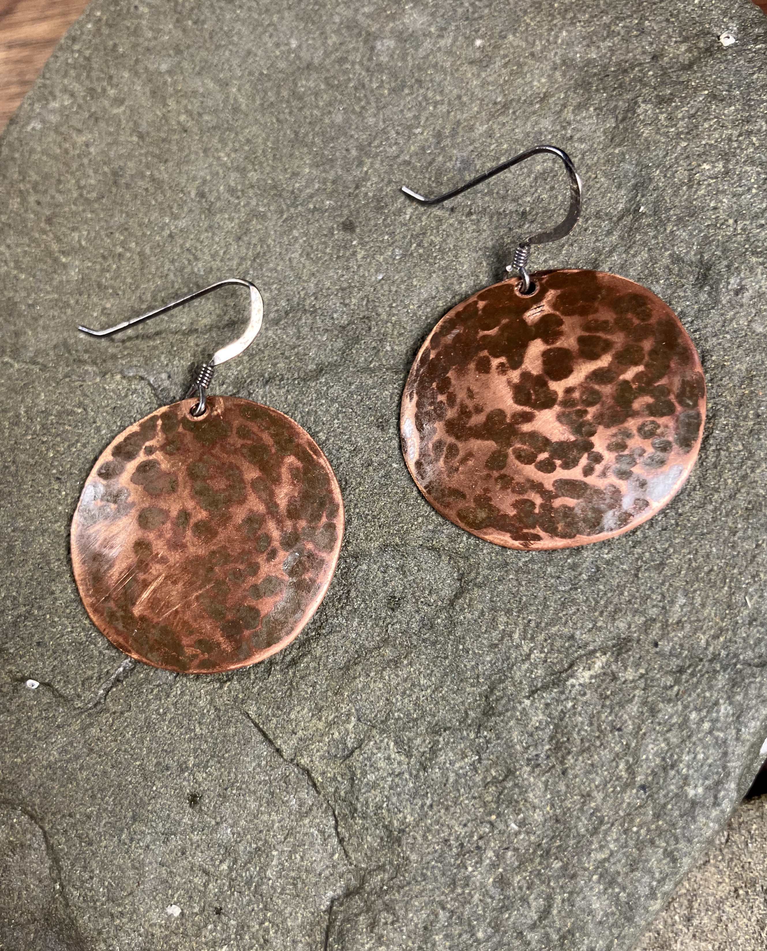 hammered copper dome with brown patina in hammer marks