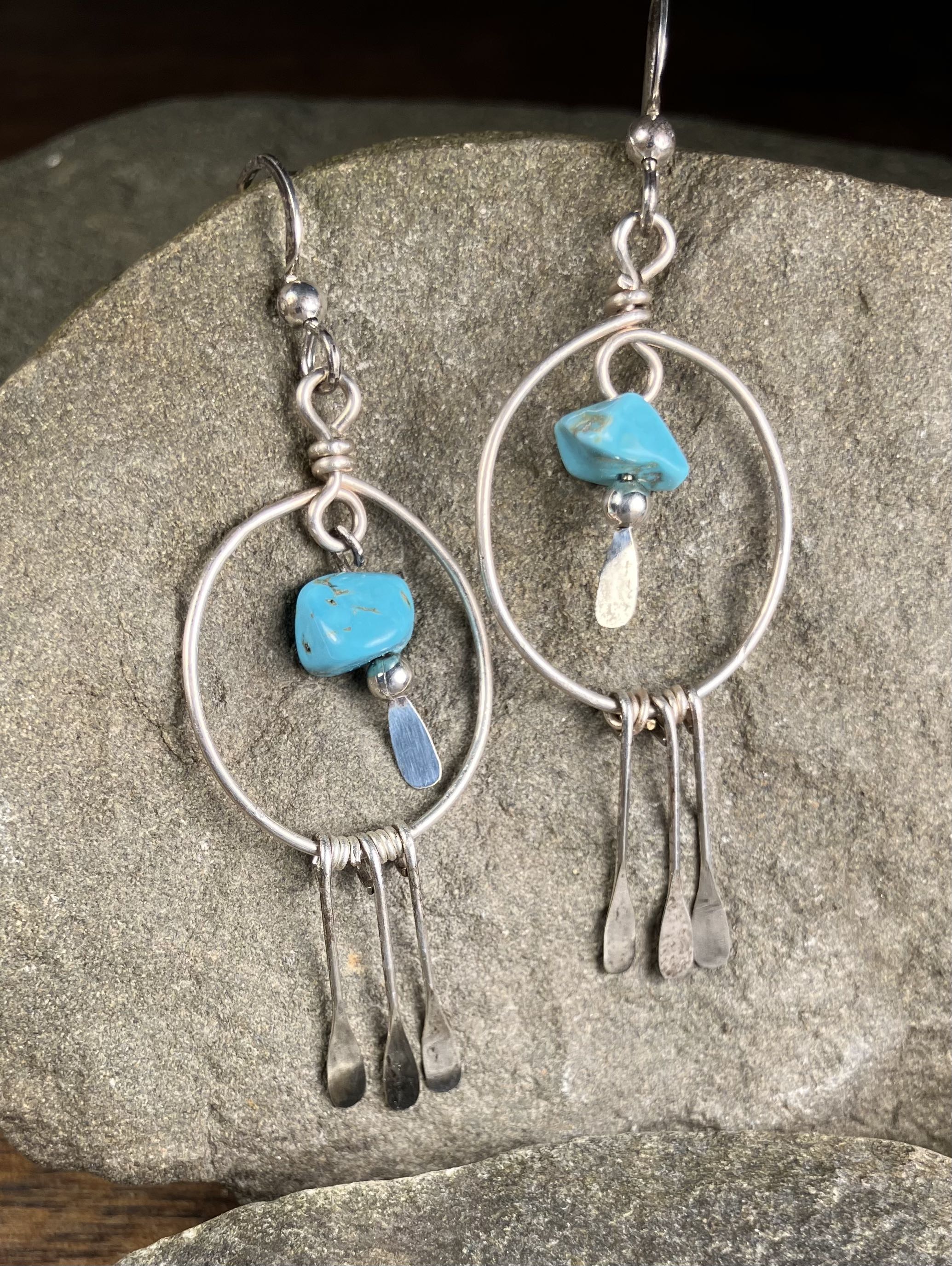 silver hoop with turquoise stone inside